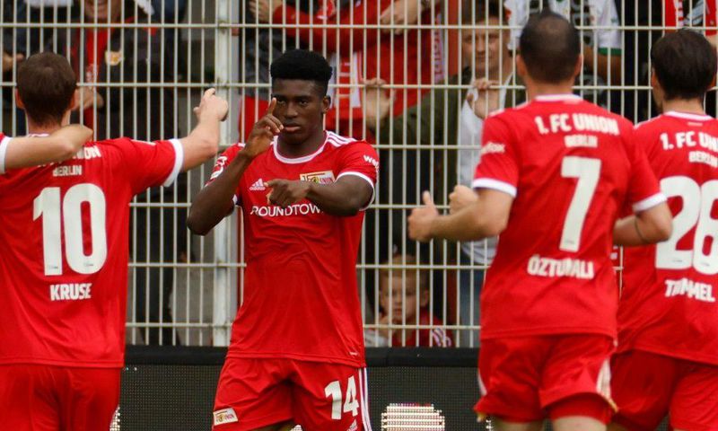 Union Berlin's Nigerian striker Taiwo Awoniyi (C) celebrates his goal on Sunday