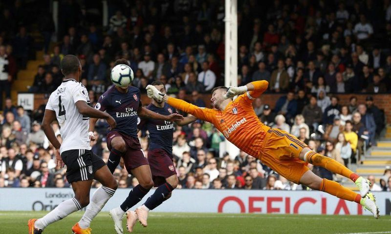 Chelsea signing - Goalkeeper Marcus Bettinelli (R) in action for former club Fulham