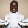 Eluid Kipchoge posing with the Alphafly Next% shoes