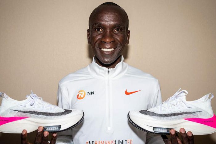 Eluid Kipchoge posing with the Alphafly Next% shoes