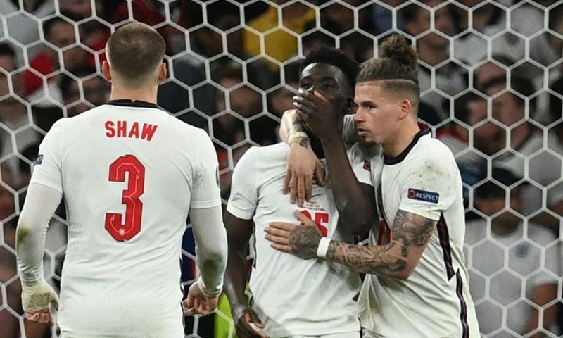 England's Bukayo Saka (centre) was racially abused online after missing the decisive penalty in the Euro 2020 final against Italy