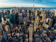 New York City, USA - August 1, 2018: Elevated view of the skyline of modern skyscrapers of Manhattan at sunset in New York City, USA