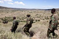 Kenyan police officers walk at the site where gunmen massacred 42 police officers in a weekend ambush, the deadliest in the country's history, in Samburu northern district near Baragoi on November 15, 2012. Police say that 42 policemen in all were killed as they hunted cattle thieves on November 10, 2012 in Baragoi, a remote district in Kenya's arid north, although the official toll still stands at 32 dead. Ivan Lieman/AFP via Getty Images