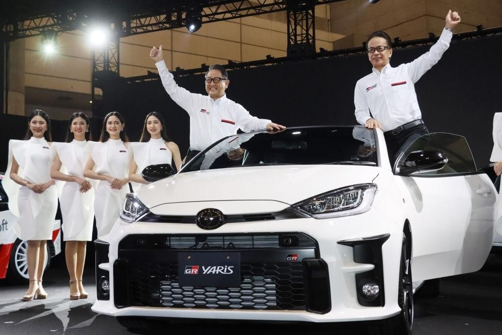 Toyota Motor President Akio Toyoda (L) and Executive Vice President Shigeki Tomoyama (D) unveil the GR Yaris rally car at the 2020 Tokyo Auto Salon in Chiba, a suburb of Tokyo on January 10, 2020, Japan. (Photo by YOSHIKAZU TSUNO/Gamma-Rapho via Getty Images)