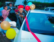 Tanya  Ngirici enjoying her brand new car.