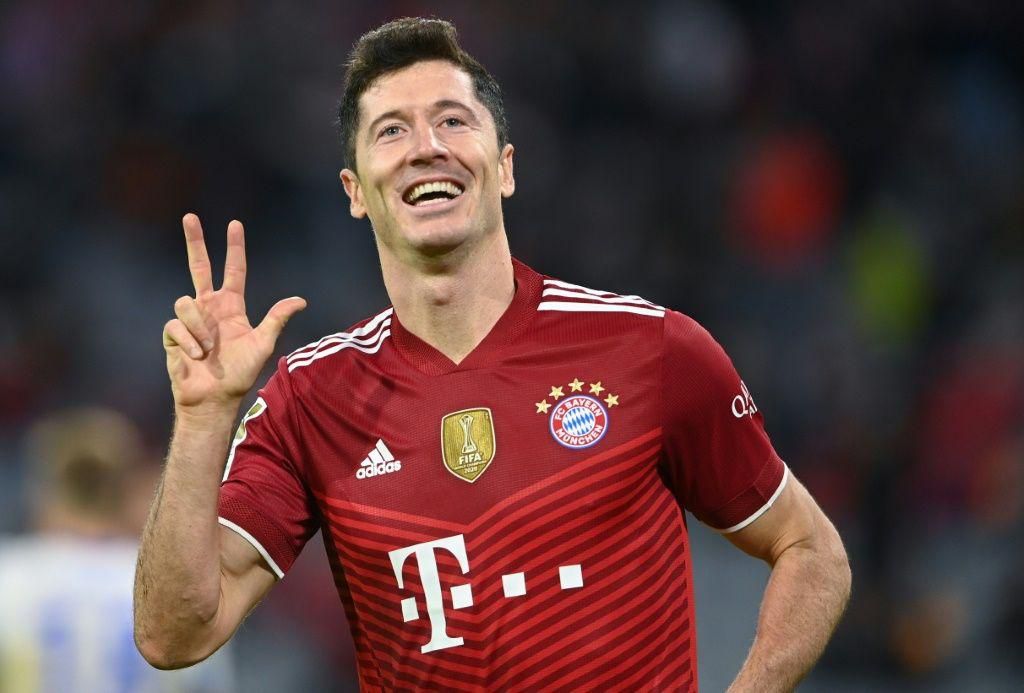 Robert Lewandowski celebrates his hat-trick as Bayern Munich thrashed Hertha Berlin 5-0 on Saturday