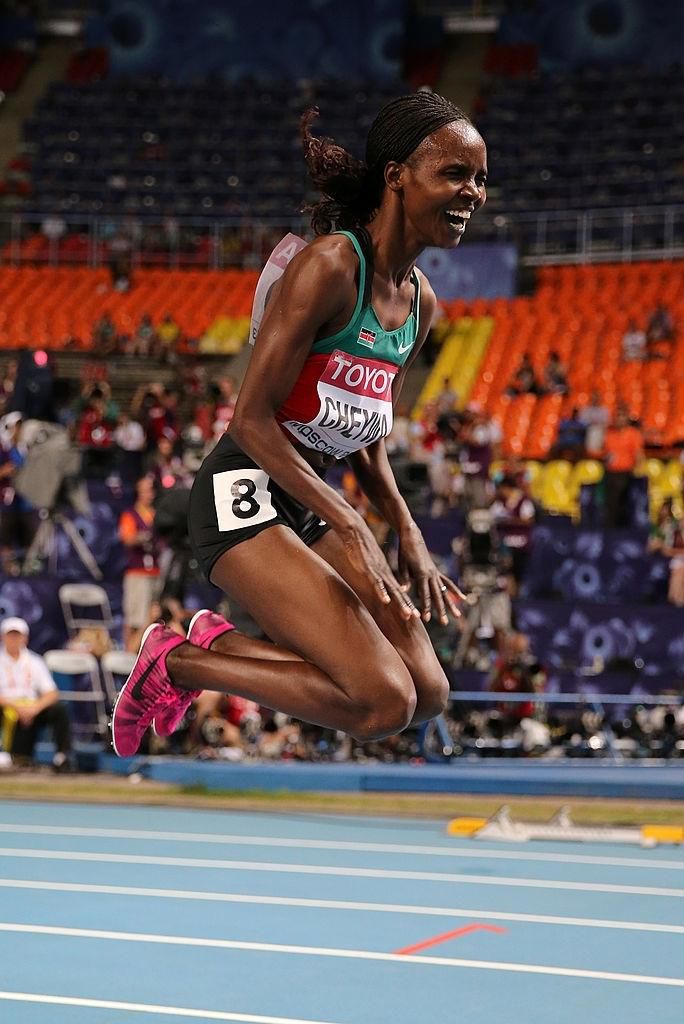 MOSCOW, RUSSIA - AUGUST 13: Milcah Chemos Cheywa of Kenya celebrates winning gold in the Women's 3000 metres steeplechase final during Day Four of the 14th IAAF World Athletics Championships Moscow 2013 at Luzhniki Stadium on August 13, 2013 in Moscow, Russia. (Photo by Ian Walton/Getty Images)