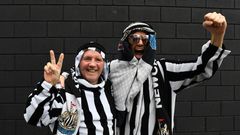Newcastle fans pose in Arab-style clothing at St James' Park