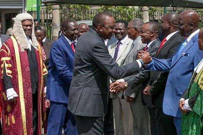 Gem MP Jakoyo Midiwo greeting President Uhuru Kenyatta. Midiwo has finally broken his silence over a Cabinet Secretary position allegedly offered to him by President Uhuru Kenyatta.