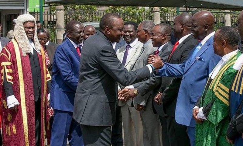 Gem MP Jakoyo Midiwo greeting President Uhuru Kenyatta. Midiwo has finally broken his silence over a Cabinet Secretary position allegedly offered to him by President Uhuru Kenyatta.