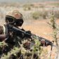 A Kenya Defence Forces (KDF) soldier, part of the African Mission in Somalia (AMISOM), secures an area during a foot patrol on the outskirts of the controlled area of the old airport in the coastal town of Kismayu in southern Somalia November 12, 2013....