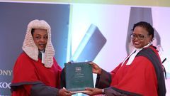 Chief Justice Martha Karambu Koome receives instruments of power and the state of the Judiciary report from Deputy Chief Justice Philomena Mbete Mwilu