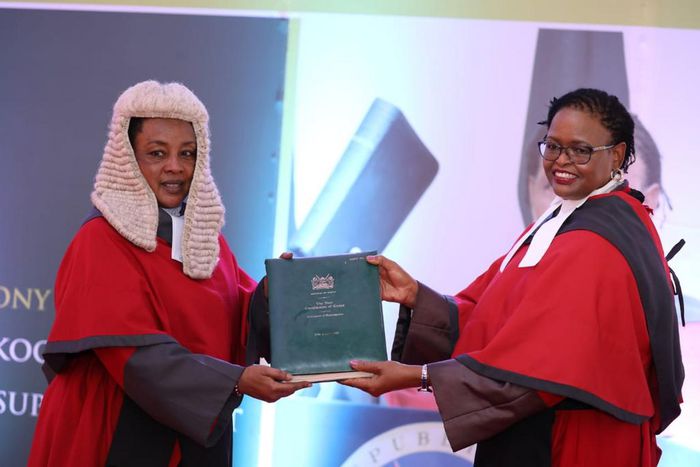 Chief Justice Martha Karambu Koome receives instruments of power and the state of the Judiciary report from Deputy Chief Justice Philomena Mbete Mwilu