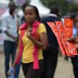 An Aids Healthcare Foundation-Kenya worker distributes condoms in the streets of Nairobi on February 14, 2014 to promote safe sex practices during the Valentine week and to mark the International Condom Day. A non-governmental organisation is planning ...