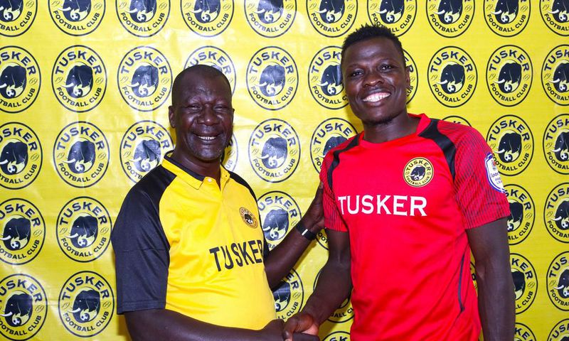 Tusker F.C head coach Robert Matano (left) welcomes new signing Patrick Matasi (right).