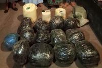 Bales of bhang and containers of illicit alcohol confiscated by DCI