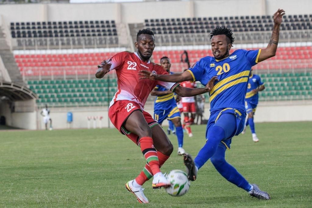 Kenya's Abdalla Hassan (L) fights for the ball with Rwanda's Nshuti Dominique Savio (R) during the FIFA World Cup Qatar 2022 qualifying round group E football match between Kenyan and Rwanda at the Nyayo national stadium in Nairobi on November 15, 2021. (Photo by SIMON MAINA/AFP via Getty Images)