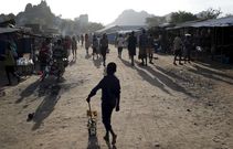 A boy from Karamojong plays with a toy decorated with election posters in town of Kaabong in Karamoja region, Uganda February 17, 2016. REUTERS/Goran Tomasevic
