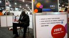 FILE PHOTO: A job-seeker completes an application at a career job fair in Philadelphia, Pennsylvania, U.S. July 25, 2013.  REUTERS/Mark Makela/File Photo   GLOBAL BUSINESS WEEK AHEAD