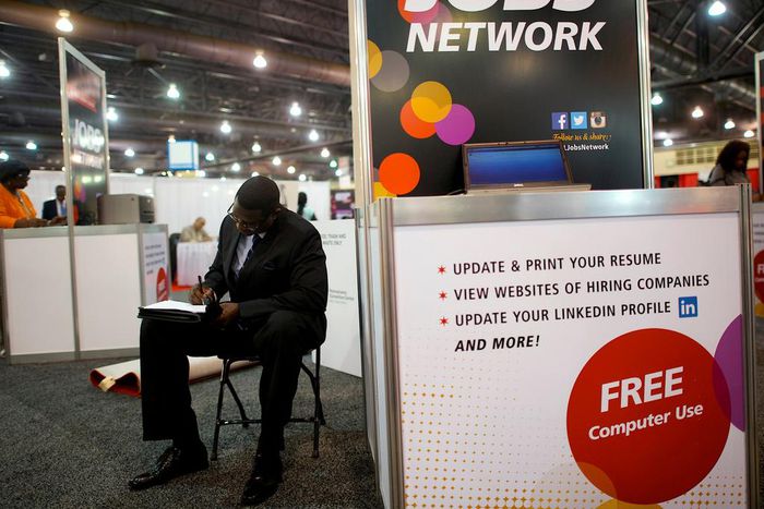 FILE PHOTO: A job-seeker completes an application at a career job fair in Philadelphia, Pennsylvania, U.S. July 25, 2013.  REUTERS/Mark Makela/File Photo   GLOBAL BUSINESS WEEK AHEAD