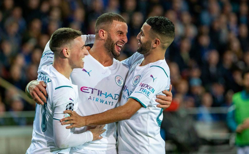 Kyle Walker (C) and Riyad Mahrez (R) both scored as Manchester City demolished Belgian champions Club Brugge