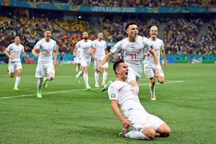 Mario Gavranovic celebrates his late equaliser that forced extra time against France