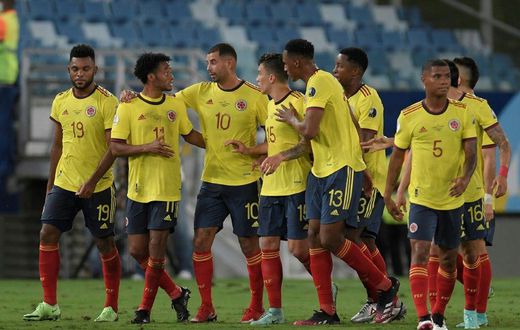 Edwin Cardona (3rd left) and his Colombia teammates celebrate the winning goal against Ecuador
