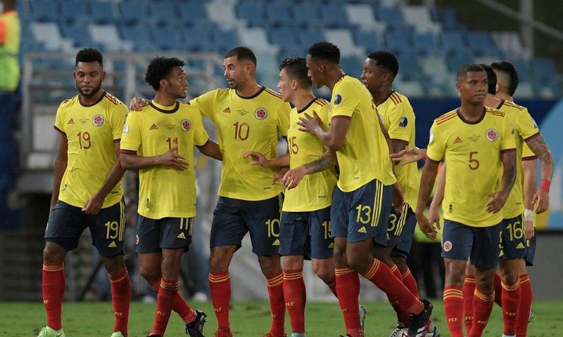 Edwin Cardona (3rd left) and his Colombia teammates celebrate the winning goal against Ecuador