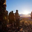 Kenyan Police officers look over the vally on November 15, 2012where the mass killings of police took place in Samburu north district near Baragoi . Some of the remaining four bodies where found close to where the ambush took place by alleged Turkana c...