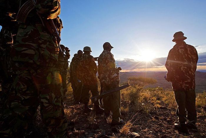 Kenyan Police officers look over the vally on November 15, 2012where the mass killings of police took place in Samburu north district near Baragoi . Some of the remaining four bodies where found close to where the ambush took place by alleged Turkana c...