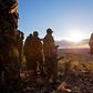 Kenyan Police officers look over the vally on November 15, 2012where the mass killings of police took place in Samburu north district near Baragoi . Some of the remaining four bodies where found close to where the ambush took place by alleged Turkana c...