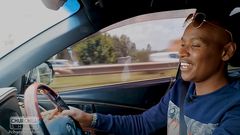 Musician Samidoh behind the wheel of his Toyota Harrier