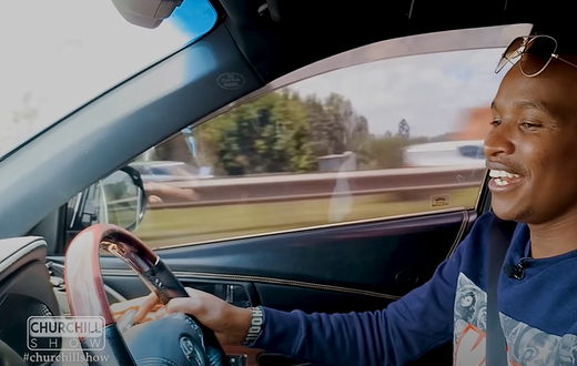 Musician Samidoh behind the wheel of his Toyota Harrier