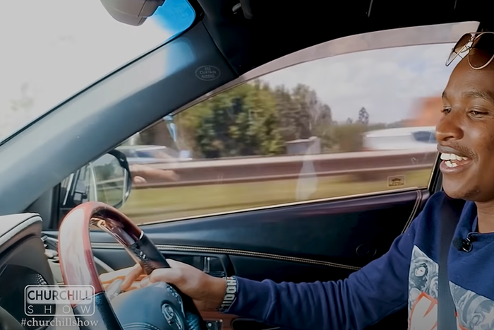 Musician Samidoh behind the wheel of his Toyota Harrier