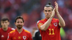 Gareth Bale (right) has pledged to continue leading Wales as captain