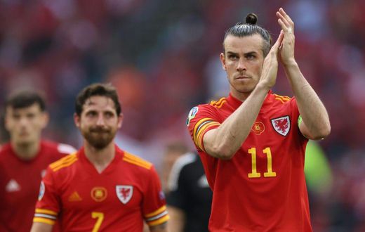 Gareth Bale (right) has pledged to continue leading Wales as captain