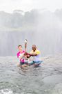 British High Commissioner Nicholas Wooley and Tourism Minister Rhodine Sikumba at the Edge of Devil's Pool at Victoria Falls