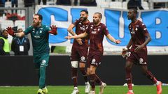 Unhappy: Metz players react after French referee Jerome Brisard gives a red card to Brazilian defender Jemerson