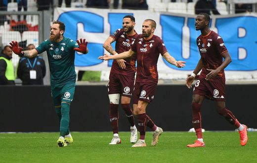 Unhappy: Metz players react after French referee Jerome Brisard gives a red card to Brazilian defender Jemerson