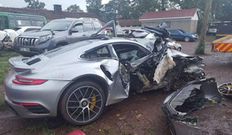 The wreckage of John Gichia's Porsche 911 Turbo S after the road accident that claimed his life
