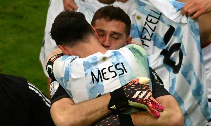 Lionel Messi celebrates with goalkeeeper Emiliano Martinez whose three penalty shoot-out saves sent Argentina into the Copa America final