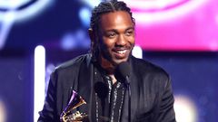 Kendrick Lamar onstage with his Grammys [billboard]