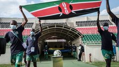 Boys enter with Kenya's national flag before the FIFA World Cup 2022 qualifier football match between Kenya and Mali at Nyayo national stadium in Nairobi on October 10, 2021. (Photo by YASUYOSHI CHIBA/AFP via Getty Images)