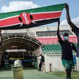 Boys enter with Kenya's national flag before the FIFA World Cup 2022 qualifier football match between Kenya and Mali at Nyayo national stadium in Nairobi on October 10, 2021. (Photo by YASUYOSHI CHIBA/AFP via Getty Images)