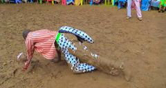 Kisii musician Chris Embarambamba rolling in the mud