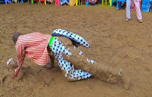 Kisii musician Chris Embarambamba rolling in the mud