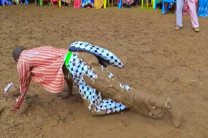 Kisii musician Chris Embarambamba rolling in the mud