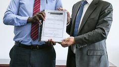 KeNHA Director General Eng. Peter Mundinia with representative from China Communication Construction Company (CCCC)