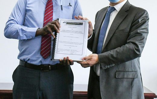 KeNHA Director General Eng. Peter Mundinia with representative from China Communication Construction Company (CCCC)