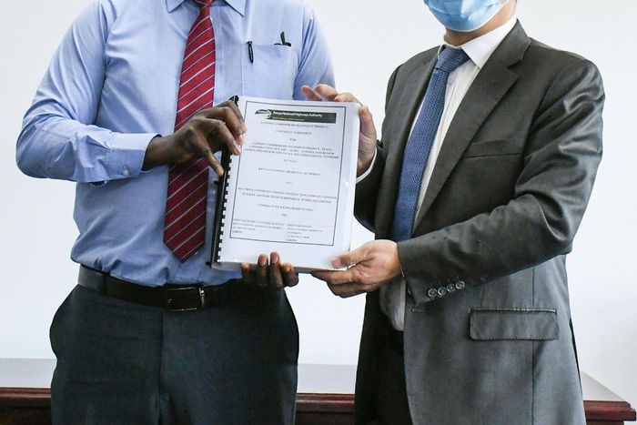 KeNHA Director General Eng. Peter Mundinia with representative from China Communication Construction Company (CCCC)